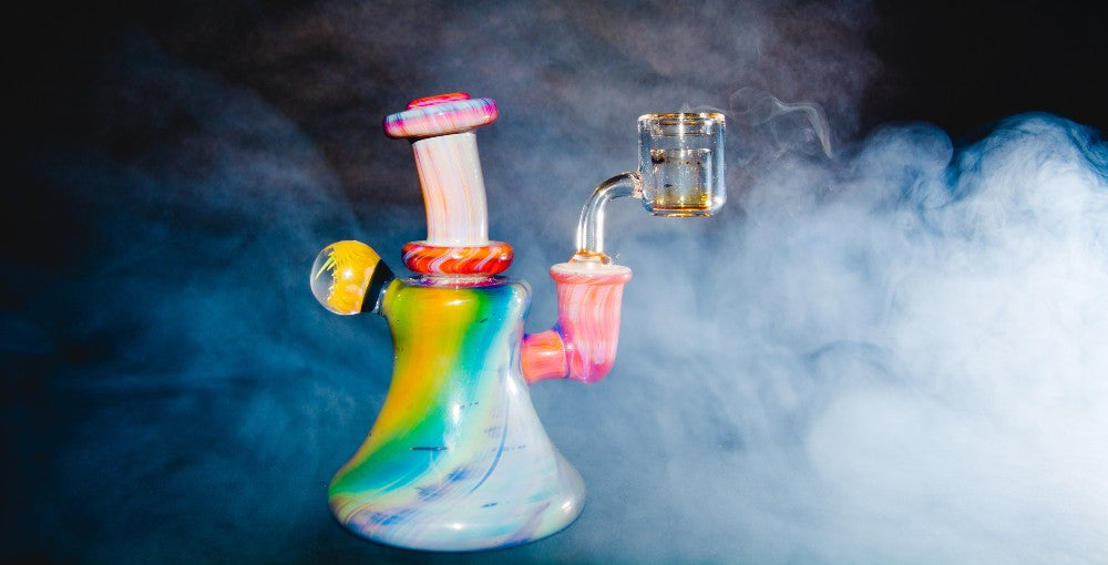 a dab rig with vapor surrounding it